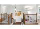 A beautifully designed staircase with wooden handrails and wrought iron spindles leads to the upper level at 3315 High Noontide Nw Way, Acworth, GA 30101