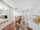 Staircase with wooden handrails and wrought iron spindles with a view of the living room at 3315 High Noontide Nw Way, Acworth, GA 30101