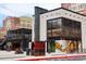 Exterior view of buildings in Atlantic Station featuring outdoor seating and shops at 400 17Th St # 2325, Atlanta, GA 30363