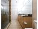 Bright bathroom features a glass shower, double vanity, and granite countertops at 400 17Th St # 2325, Atlanta, GA 30363