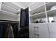 Spacious walk-in closet with custom shelving and hanging rods for efficient storage solutions at 400 17Th St # 2325, Atlanta, GA 30363