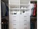 Custom closet features built-in shelving and drawers to keep clothes and accessories organized at 400 17Th St # 2325, Atlanta, GA 30363