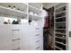 This organized closet offers shelving and drawer storage to keep clothes and accessories accessible at 400 17Th St # 2325, Atlanta, GA 30363