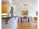 Open floor plan connects kitchen to a modern dining area with hardwood floors at 400 17Th St # 2325, Atlanta, GA 30363