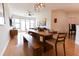 Spacious dining room with a long table, bench seating, and a modern light fixture at 400 17Th St # 2325, Atlanta, GA 30363