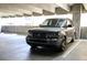 Sleek gray Range Rover parked in a well-lit parking garage spot at 400 17Th St # 2325, Atlanta, GA 30363