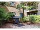 Outdoor gas grill available for apartment tenants, in a landscaped area at 400 17Th St # 2325, Atlanta, GA 30363
