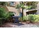 Grill surrounded by lush landscaping in a outdoor area at 400 17Th St # 2325, Atlanta, GA 30363