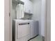 Convenient laundry room with modern washer and dryer units and ample storage at 400 17Th St # 2325, Atlanta, GA 30363