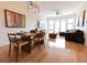 Open concept living and dining area with hardwood floors and large windows at 400 17Th St # 2325, Atlanta, GA 30363
