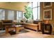 Comfortable resident lounge with a spacious sectional sofa and a view of the workout area at 400 17Th St # 2325, Atlanta, GA 30363