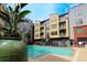 Beautiful community pool surrounded by chairs and potted plants at 400 17Th St # 2325, Atlanta, GA 30363