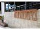 Close-up view of a sign for The Interlock shopping area with concrete background at 400 17Th St # 2325, Atlanta, GA 30363