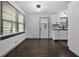 Bright dining area showcasing hardwood floors, a large window, and access to the kitchen at 1553 Mccallie Nw Blvd, Atlanta, GA 30318