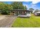 Charming renovated home with a covered carport and inviting front porch at 1553 Mccallie Nw Blvd, Atlanta, GA 30318
