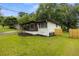 Charming renovated home with a covered carport, freshly landscaped yard, and new fence at 1553 Mccallie Nw Blvd, Atlanta, GA 30318