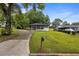 Charming renovated home with a covered carport, freshly landscaped yard, and new fence at 1553 Mccallie Nw Blvd, Atlanta, GA 30318