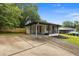 Charming renovated home with a covered carport and inviting front porch at 1553 Mccallie Nw Blvd, Atlanta, GA 30318