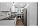 Stylish kitchen with white cabinets, modern stainless steel appliances, and sleek countertops at 1553 Mccallie Nw Blvd, Atlanta, GA 30318