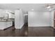 Spacious living room with hardwood floors, adjacent to a stylish kitchen and open layout at 1553 Mccallie Nw Blvd, Atlanta, GA 30318