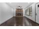Modern living room featuring hardwood floors, a decorative fireplace and a ceiling fan at 1553 Mccallie Nw Blvd, Atlanta, GA 30318