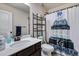 Bathroom with a white sink and a shower with a decorative curtain at 1626 Waterchase Dr, Dacula, GA 30019