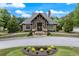 Community clubhouse featuring stone and brick exterior, and professionally landscaped grounds at 1626 Waterchase Dr, Dacula, GA 30019