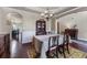 Dining room showcasing hardwood floors, traditional furniture, and an open layout at 1626 Waterchase Dr, Dacula, GA 30019
