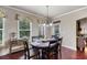 Dining room with hardwood floors, natural light, and access to a covered patio at 1626 Waterchase Dr, Dacula, GA 30019