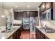 Wide kitchen angle showing granite countertops, stainless appliances, and view of the kitchen island at 1626 Waterchase Dr, Dacula, GA 30019