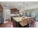 Gourmet kitchen featuring a large island with seating, stainless steel appliances, and ample cabinet space at 1626 Waterchase Dr, Dacula, GA 30019