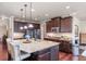 Spacious kitchen featuring a large island, granite countertops, and modern stainless steel appliances at 1626 Waterchase Dr, Dacula, GA 30019