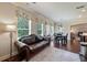 Bright living room with hardwood floors, decorative window treatment, and an arched doorway at 1626 Waterchase Dr, Dacula, GA 30019