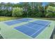 Two blue tennis courts for community members at 1626 Waterchase Dr, Dacula, GA 30019