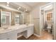 Bathroom vanity with double sinks, lots of mirror space and access to bathroom with shower/tub and toilet at 2132 Wrights Mill Ne Cir, Atlanta, GA 30324