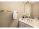 Neutral bathroom featuring a white vanity with gold hardware and gold fixtures, and a decorative mirror at 2132 Wrights Mill Ne Cir, Atlanta, GA 30324