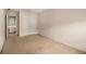 Spacious carpeted bedroom with closet, neutral wall colors, and easy access to attached bathroom at 2132 Wrights Mill Ne Cir, Atlanta, GA 30324