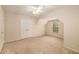 Neutral carpeted bedroom featuring double door closet, overhead fan, and bright natural light at 2132 Wrights Mill Ne Cir, Atlanta, GA 30324