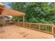 Wide wooden deck with railings provides an open space, great for relaxing and enjoying the surrounding views at 2132 Wrights Mill Ne Cir, Atlanta, GA 30324