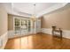 Formal dining area featuring hardwood floors, wainscoting, and a chandelier for elegant meals at 2132 Wrights Mill Ne Cir, Atlanta, GA 30324