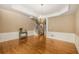 Elegant dining room features hardwood flooring, wainscoting, and a chandelier for a luxurious atmosphere at 2132 Wrights Mill Ne Cir, Atlanta, GA 30324