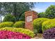 Charming community entrance sign surrounded by colorful flowers and greenery, creating a welcoming and inviting atmosphere at 2132 Wrights Mill Ne Cir, Atlanta, GA 30324
