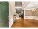 Inviting entryway features hardwood floors, wainscoting, and a staircase leading to the upper level at 2132 Wrights Mill Ne Cir, Atlanta, GA 30324