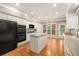Kitchen with an island, stainless steel appliances and a view to the exterior patio at 2132 Wrights Mill Ne Cir, Atlanta, GA 30324
