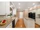 Bright kitchen with a center island, stainless appliances and white cabinets at 2132 Wrights Mill Ne Cir, Atlanta, GA 30324