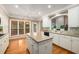 Bright kitchen featuring stainless steel appliances, an island and white cabinetry at 2132 Wrights Mill Ne Cir, Atlanta, GA 30324