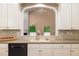 Kitchen with a view of the Gathering room through an arched doorway at 2132 Wrights Mill Ne Cir, Atlanta, GA 30324