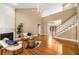 Bright living room with high ceilings, fireplace, and access to the stairway at 2132 Wrights Mill Ne Cir, Atlanta, GA 30324