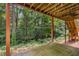 View from backyard patio surrounded by trees and stairs to the upper deck at 2132 Wrights Mill Ne Cir, Atlanta, GA 30324