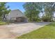 Rear view of a carport and a fenced yard creating a private and functional outdoor space at 47 Powder Springs St, Hiram, GA 30141